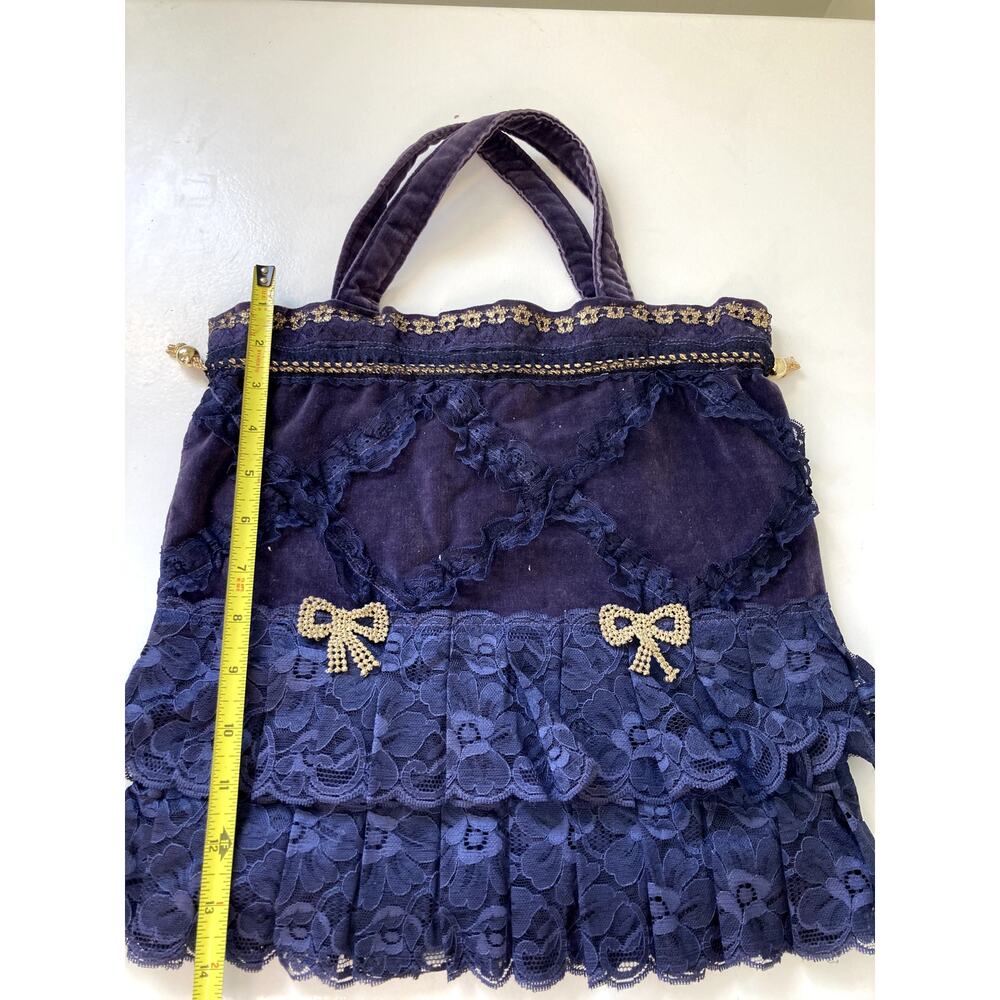 Unique bespoke purple lace purse with gold bow accents
